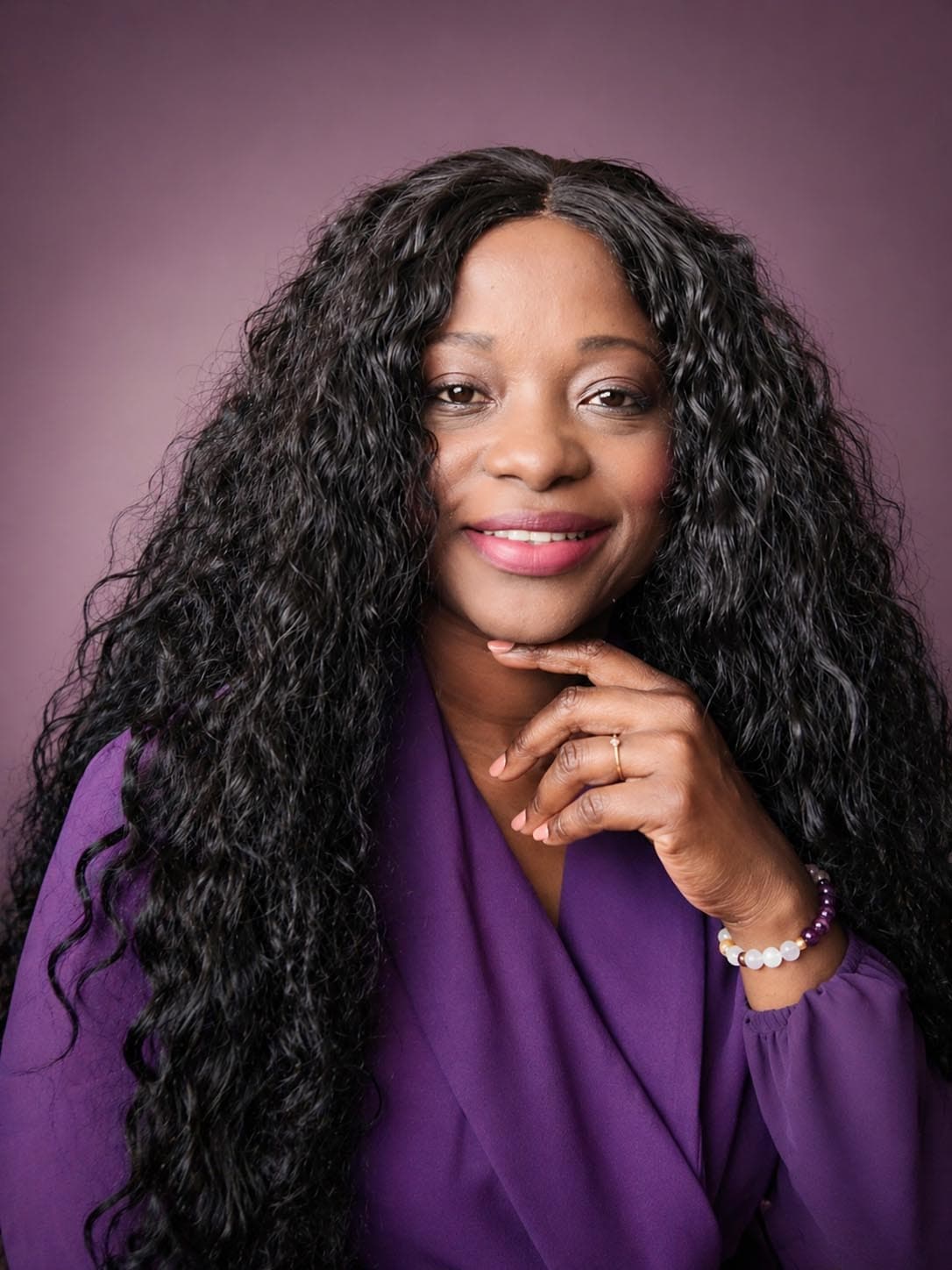 Deborah Judah-Mensah smiling in a purple dress